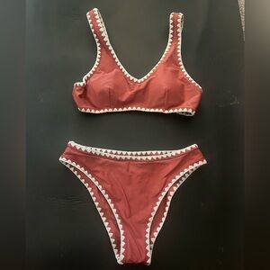 Maroon bathing suit with white stitching. Size xs